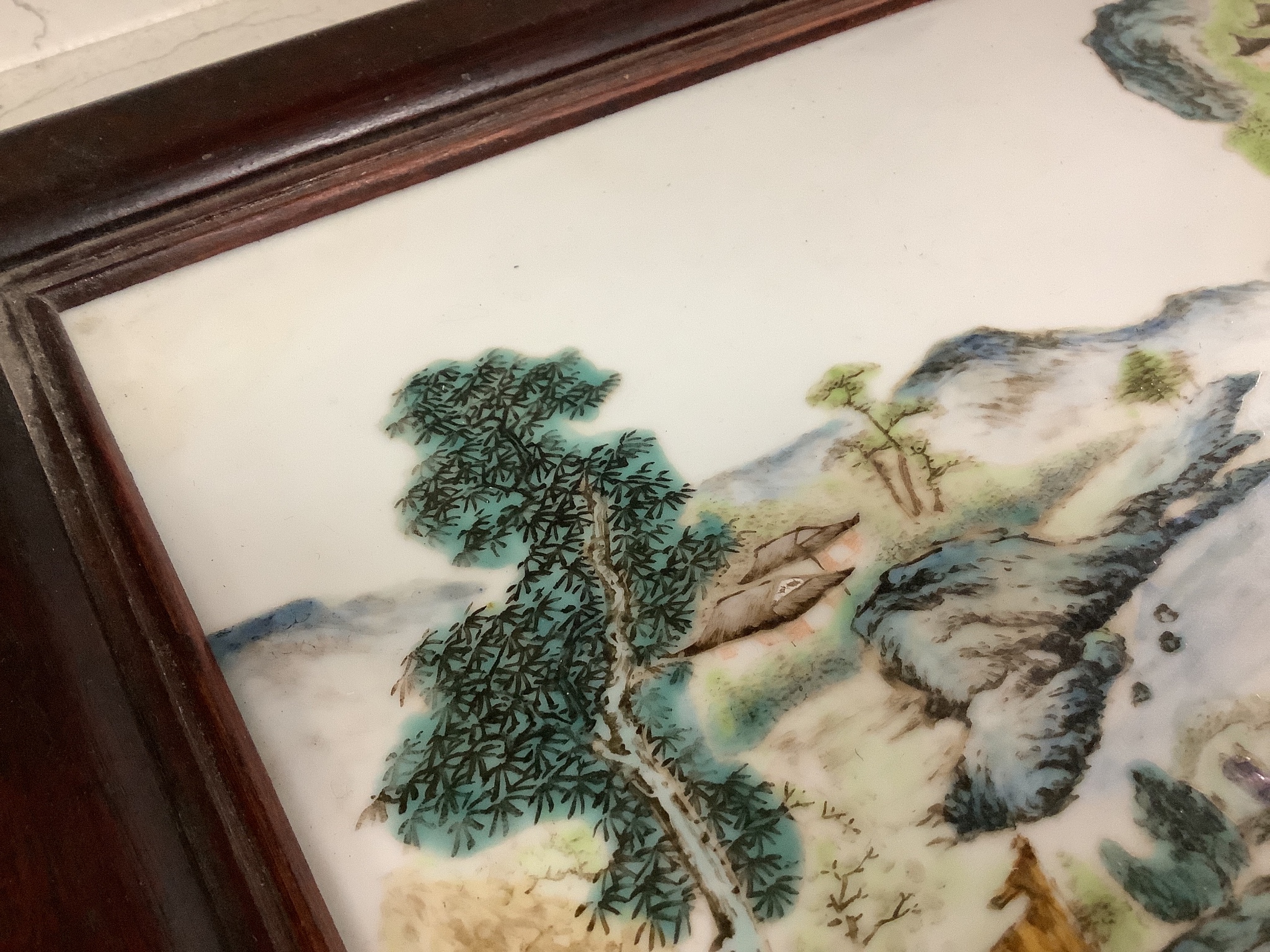 A Chinese enamelled porcelain plaque, in hardwood frame, 27 x 41cm excl. frame